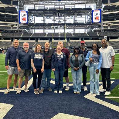 Dallas Cowboys Packages Sports Traveler Cowboys Weekend package guests on the field at AT&T Stadium